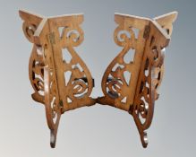 A pair of Victorian oak tripod coffin stands.