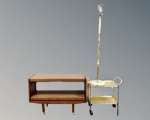 A 20th century two tier dumbwaiter trolley in a teak finish together with a further gilt two tier