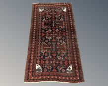 An Afghan/Caucasian rug on black ground,