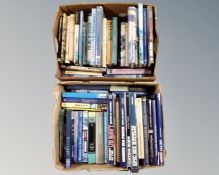 Two boxes of books relating to naval subjects.