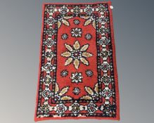 An Eastern woolen hearth rug,