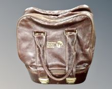 A set of Thomas Taylor lawn bowls in case