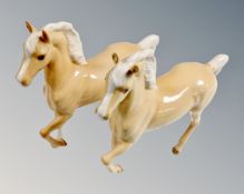 Two Beswick Palomino cantering horses.