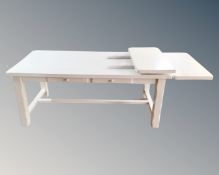 A painted refectory kitchen table fitted two drawers and two extension leaves