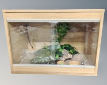 A beech effect vivarium with contents.