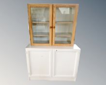 A painted double door cabinet and a pine glazed wall cabinet