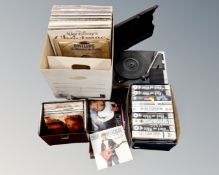 A Fidelity portable record player and a box containing vinyl LPs and 7