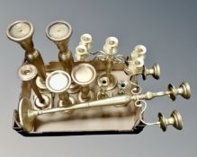 A collection of brass and brass effect table lamps and candelabrum.