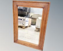 An early 20th century oak framed mirror