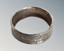 A gent's silver ring made from a 1915 half crown coin.