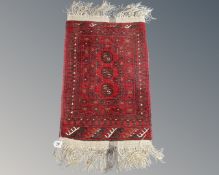 A small Afghan Bokhara rug 92 cm x 49 cm