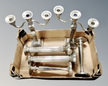 Three pairs of silver plated candlesticks and candelabrum.