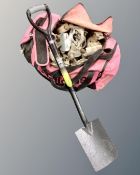 A holdall containing a large quantity of scaffolding fittings together with spade