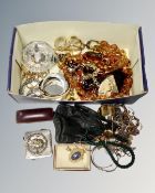 A box of assorted costume jewellery, leather purse,