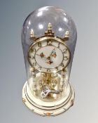 A mid century German Kundo anniversary clock under shade