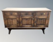 An Old Charm oak triple door linen fold sideboard CONDITION REPORT: height 87 cm x