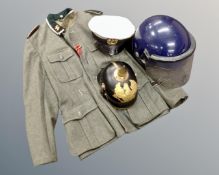 A box of replica German tunic and helmet, naval cap,