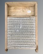 A vintage metal and pine wash board