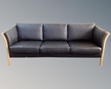 A Scandinavian black leather three seater settee