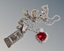 A silver mystery pendant on silver chain,