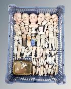 A basket of antique ceramic miniature doll parts