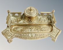 An early 20th century brass desk stand