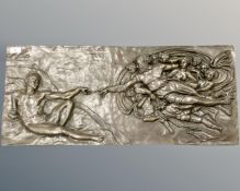 A large bronze panel 'Creation of Adam', 36 cm x 81 cm.