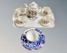 A crested ware miniature tea for two on tray with the arms of the city of London together with