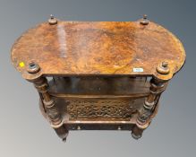 A Victorian walnut fretwork two tier trolley