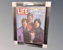 A reproduction Life Asia edition Beatles poster in frame