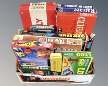 A box of vintage board games, monopoly, tank battle etc.