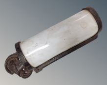 An antique metal and white glass wall light mounted with knight head