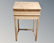 A stripped pine clerk's desk