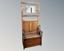 A 1930's oak mirrored hall stand