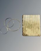 A rolled gold bangle, together with two child's expansion bracelets and a cigarette case stamped .