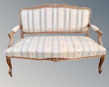 A Continental carved walnut framed salon settee
