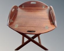 A butler's tray on folding stand