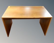 A retro style desk in teak finish