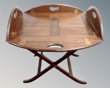 A Butler's tray on folding stand