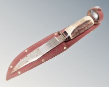 A J Howlill and Son hunting knife in leather sheath