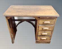 An Edwardian beech single pedestal child's desk