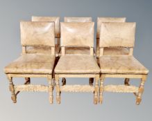 A set of six Continental light oak dining chairs in studded tan leather