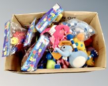 A box of novelty items, water guns,