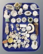 A tray of antique ceramics, dolls tea ware, china figures,