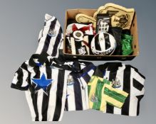 A box of Newcastle United vintage football shirts, 1892 football, scarves,