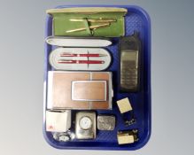 A Motorola mobile telephone together with Polaroid camera, coin holder,