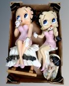 Three Betty Boop figures.