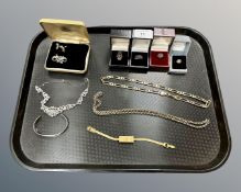 A silver bangle, further marcasite jewellery, four boxed silver dress rings,