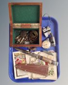 A tray including military badges, Ingersoll pocket watch, three whistles, dagger etc.