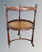 An Edwardian circular two tier tea trolley